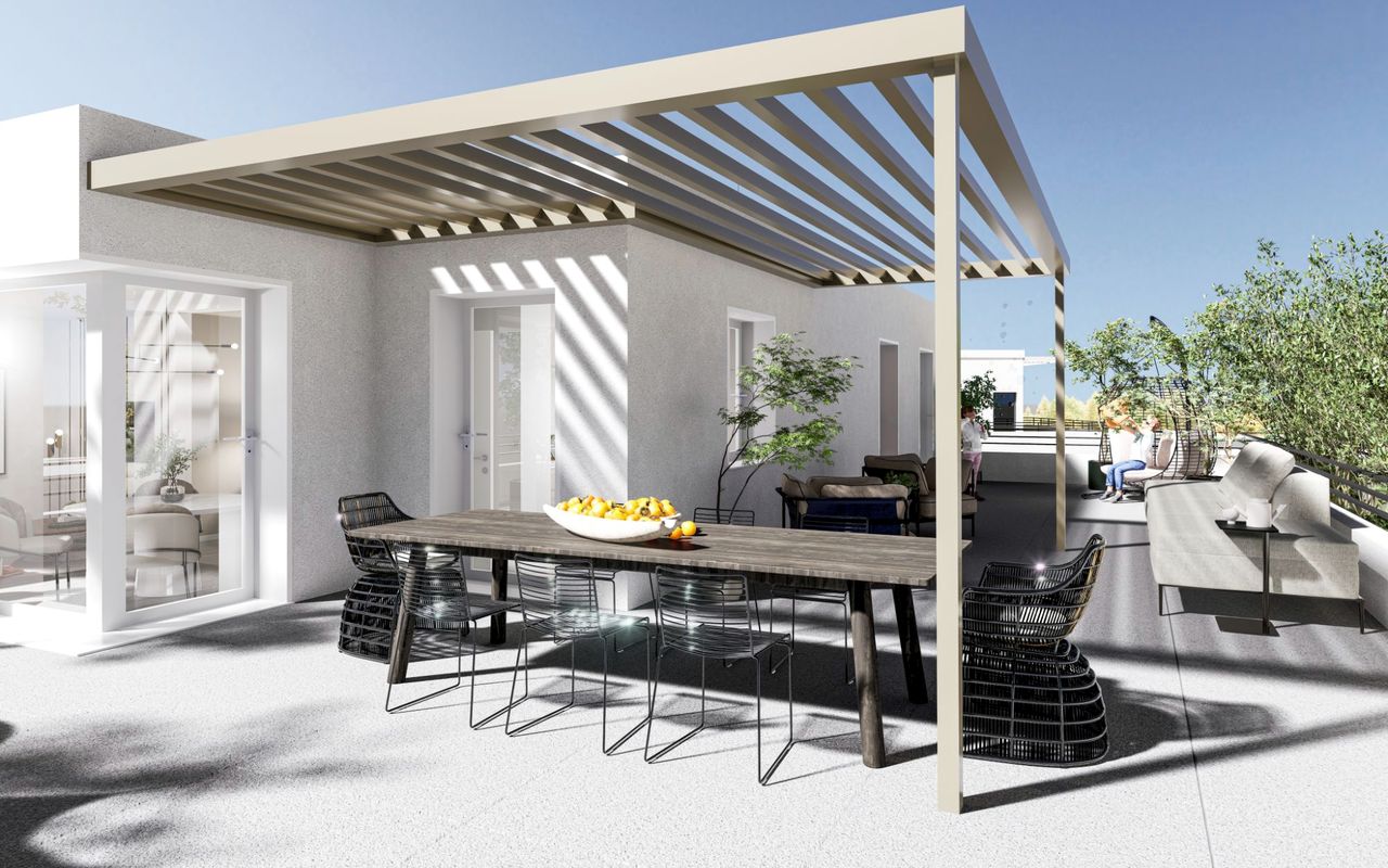 Perspective d’une terrasse en attique sous pergola, avec grande table, salon d’extérieur et vue dégagée